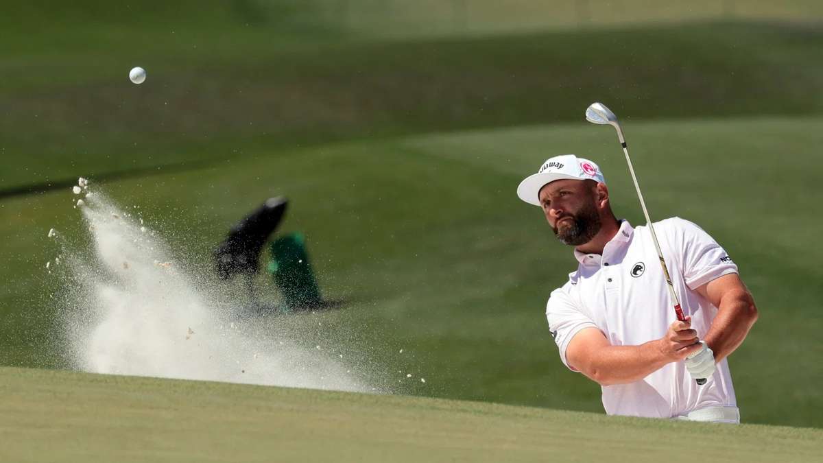 Final group walking up the 18th fairway at Augusta National during the final round