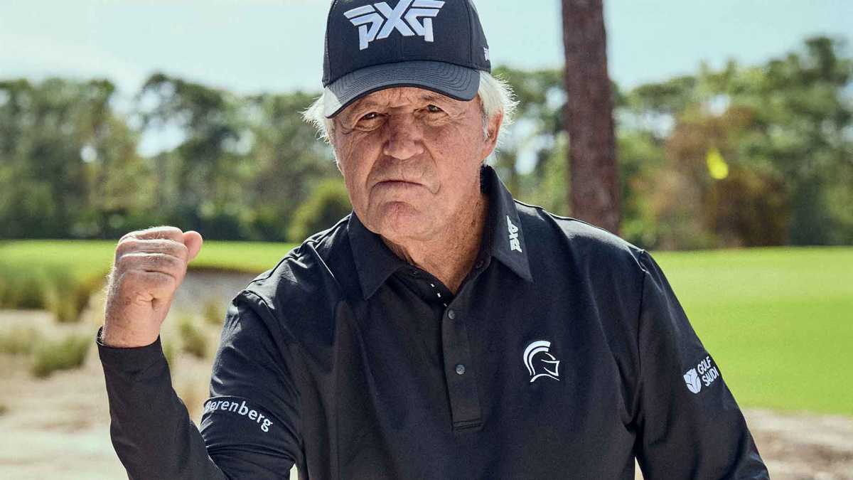 Gary Player completing a powerful golf swing on a sunny course, showing athletic posture and focused expression