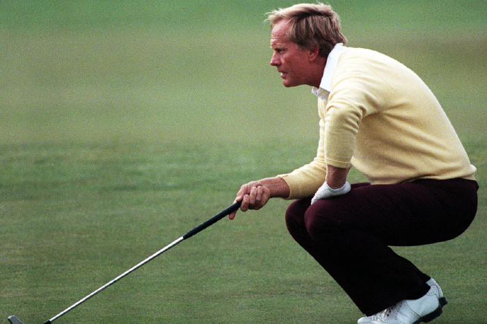 Jack Nicklaus mid-swing on a championship course with spectators watching from the fairway